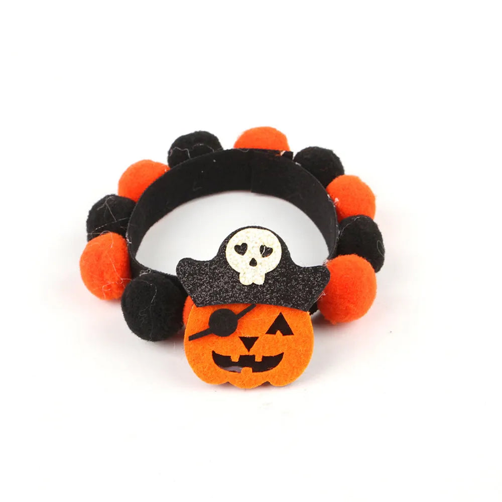 Halloween pet collar with a fur ball decoration in a pumpkin design, shown in size M