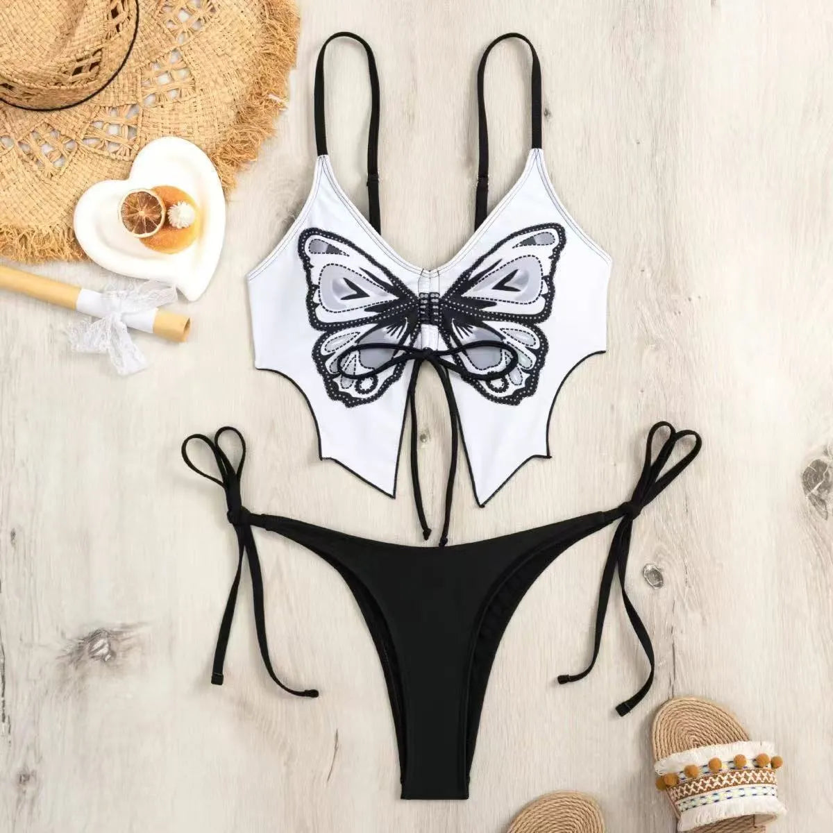 Women's purple split bow back bikini swimsuit set on mannequin, showing sleeveless top and briefs.