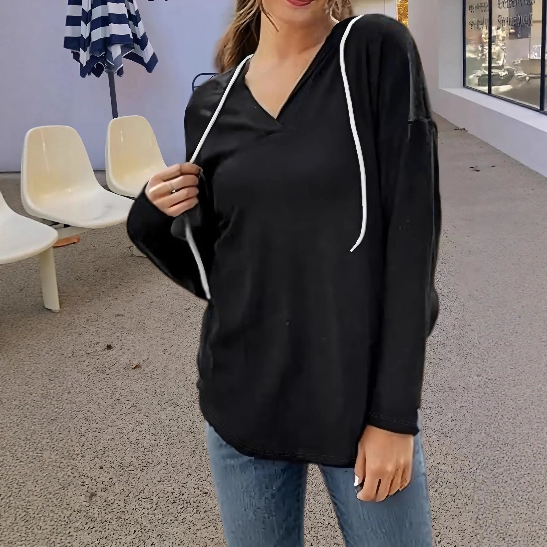 Women's V-neck hooded sweatshirt in black or red with long sleeves and loose fit