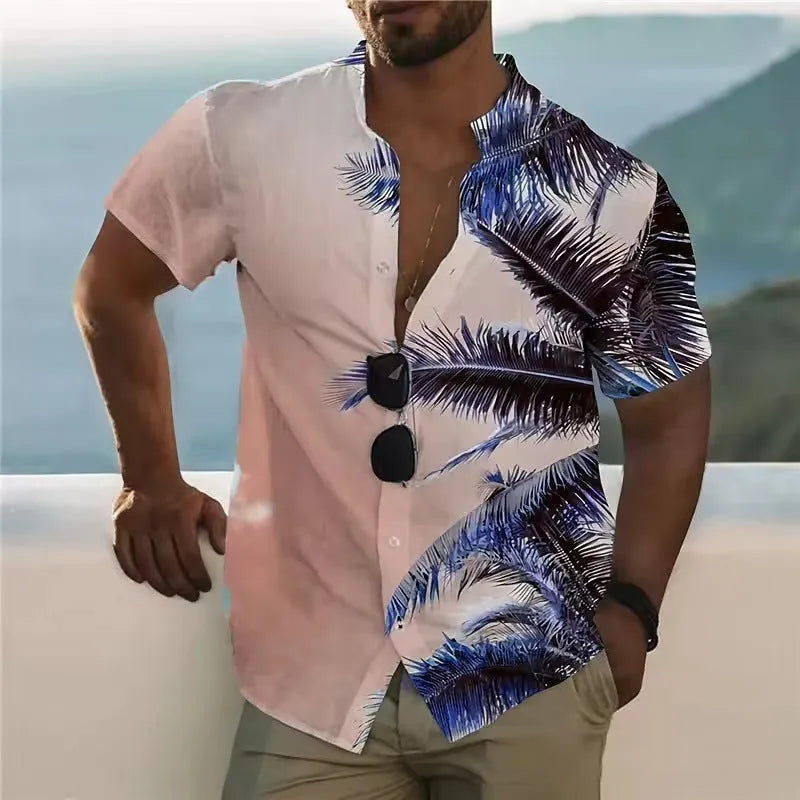 Man wearing a loose-fitting short-sleeve shirt with a colourful floral print pattern.