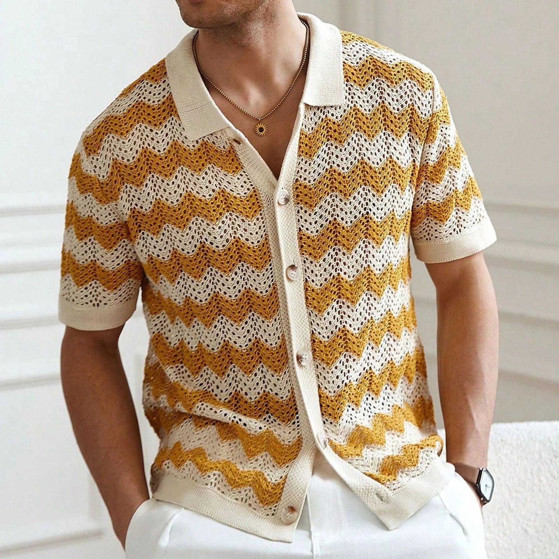 Short sleeve blue hollow jacquard corrugated sweater with flocking detail on a hanger.