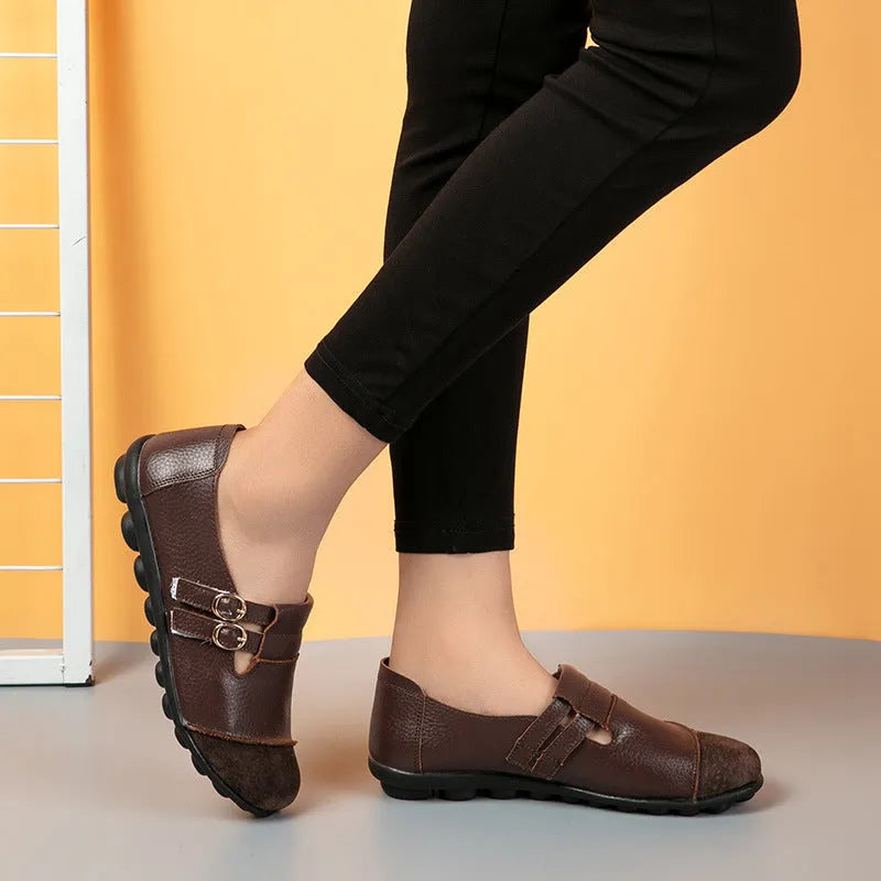 Women's casual round-toe flat shoes with a black Velcro strap on a cow leather upper.