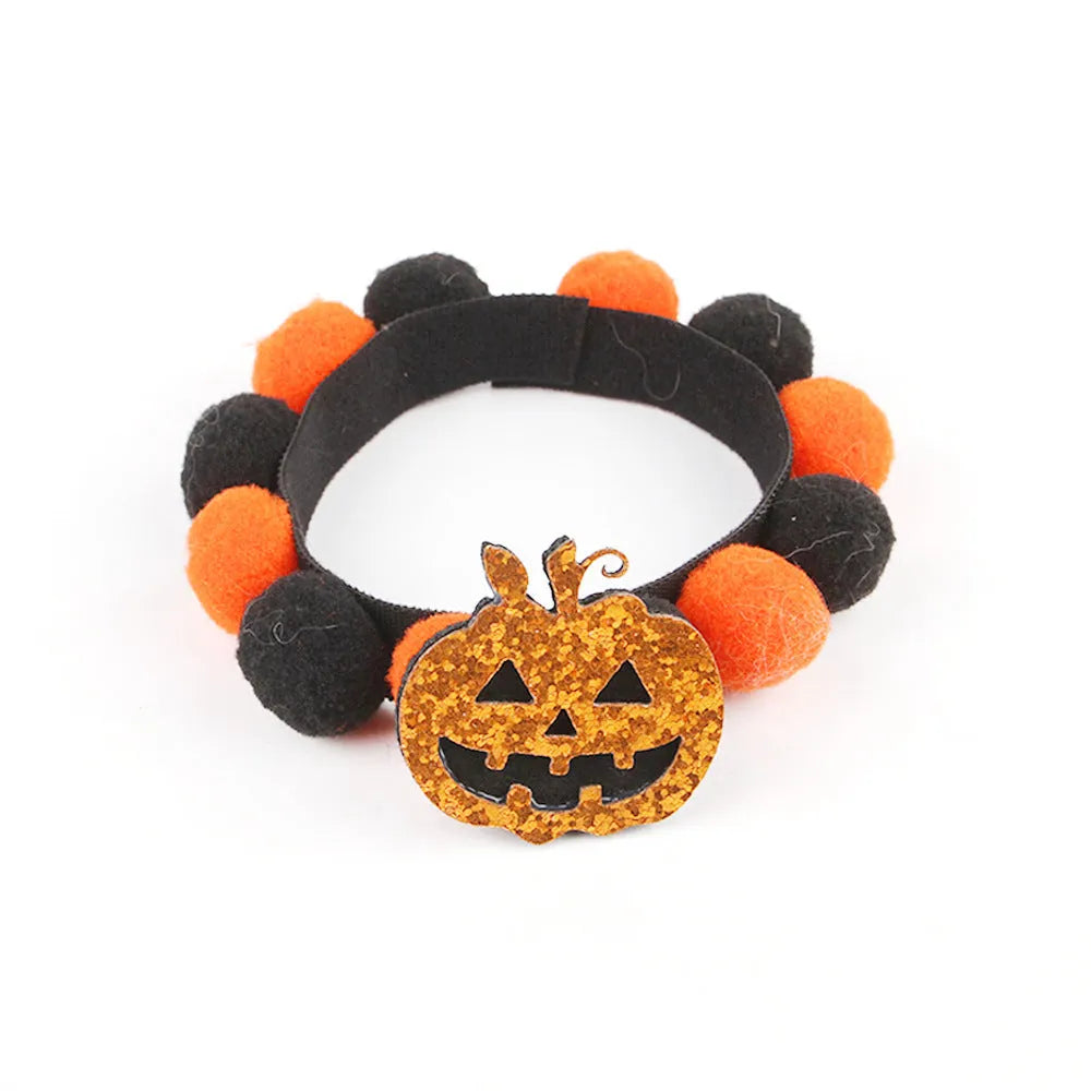 Halloween pet collar with a fur ball decoration in a pumpkin design, shown in size M