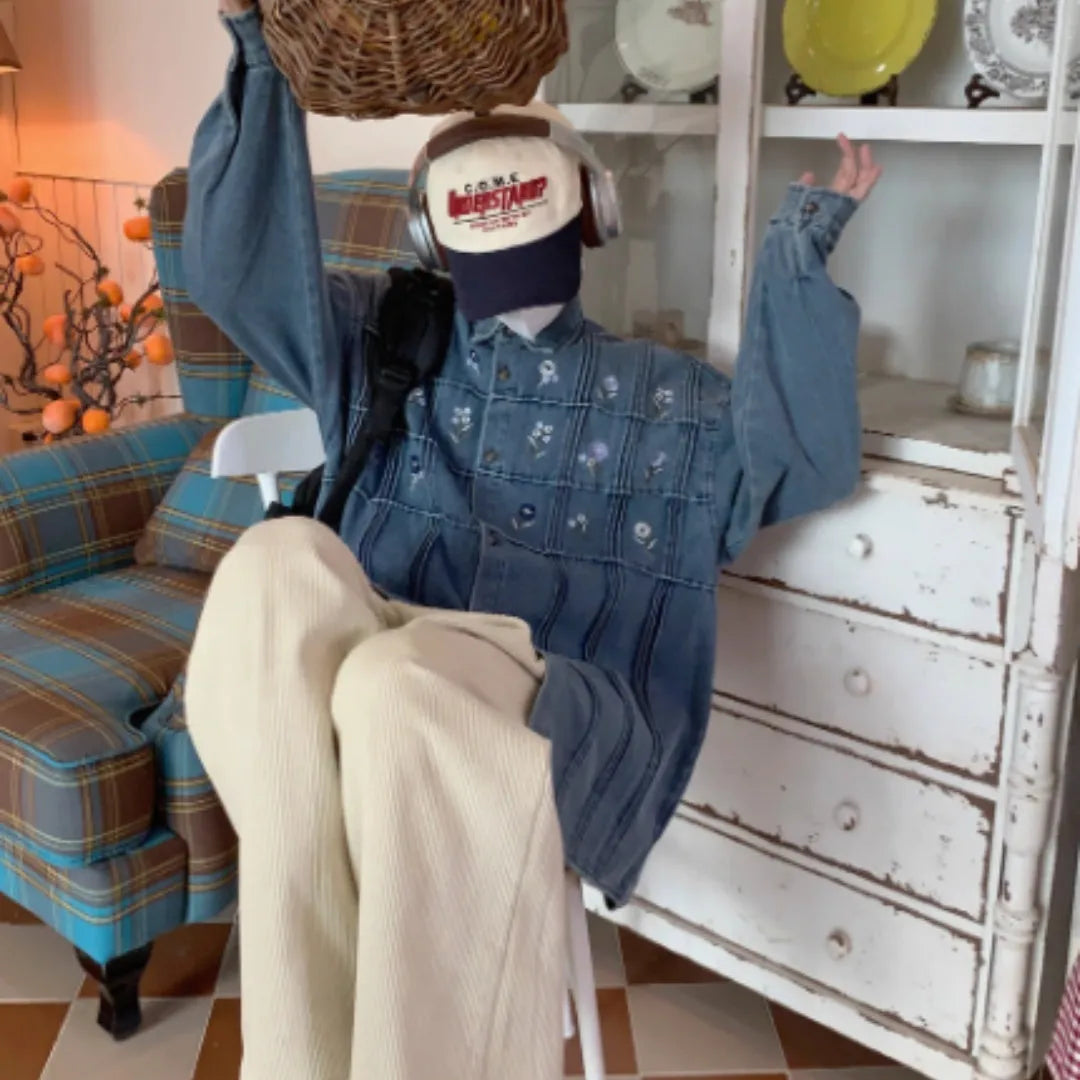 Vintage washed blue denim shirt with floral pleated detailing and long sleeves
