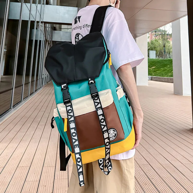 Oxford cloth backpack shown in black, green, or red, featuring multiple carry handles and straps.