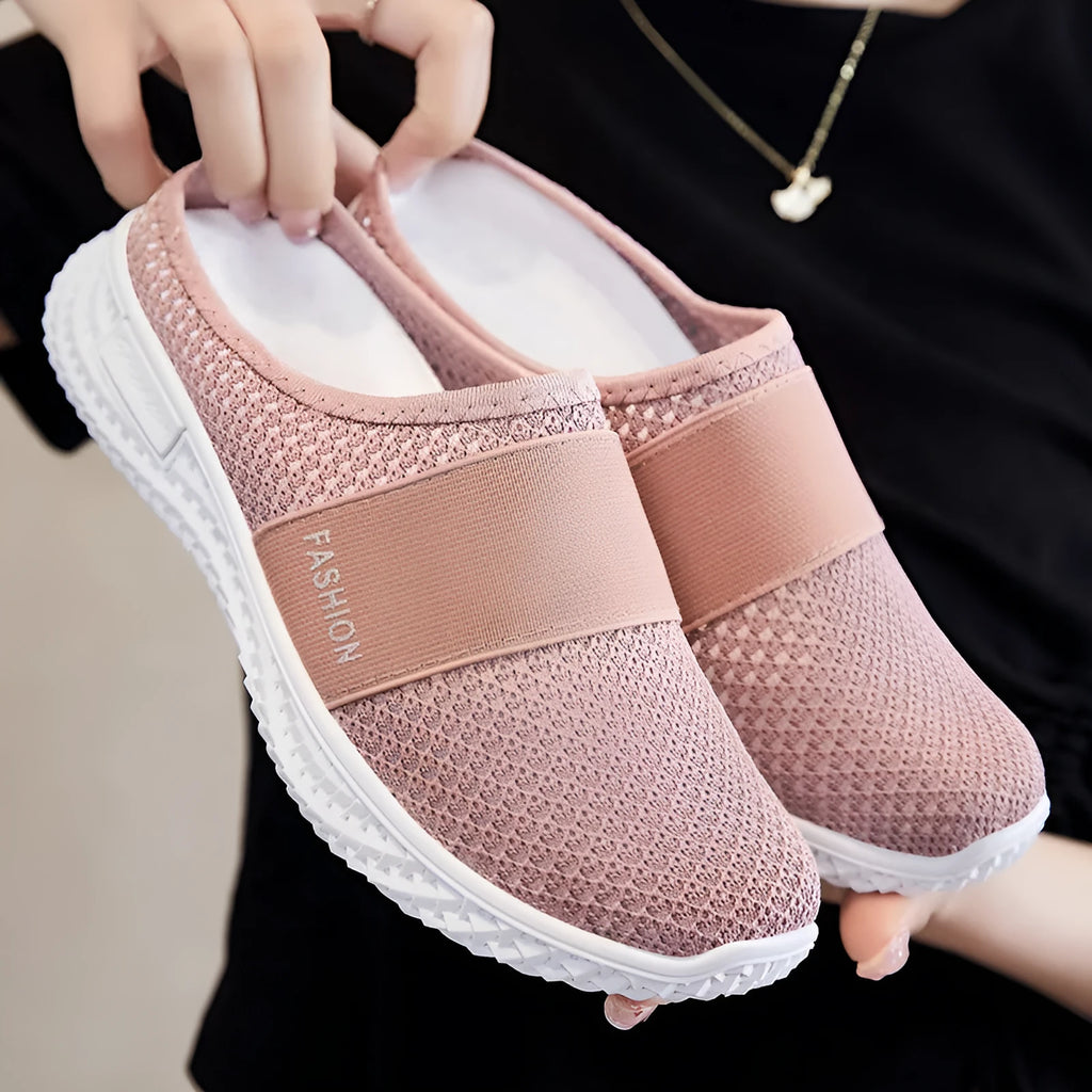 Women's breathable mesh casual shoes with flat heel, round toe, and hollow-out design in black, grey, pink, or purple.