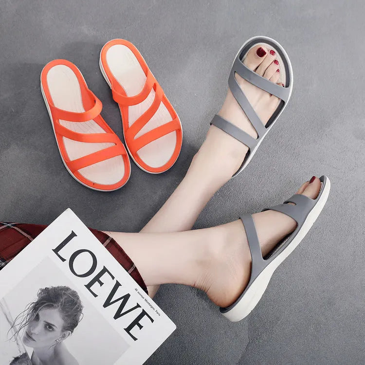 Women's solid colour breathable summer sandals in red, shown from the side.