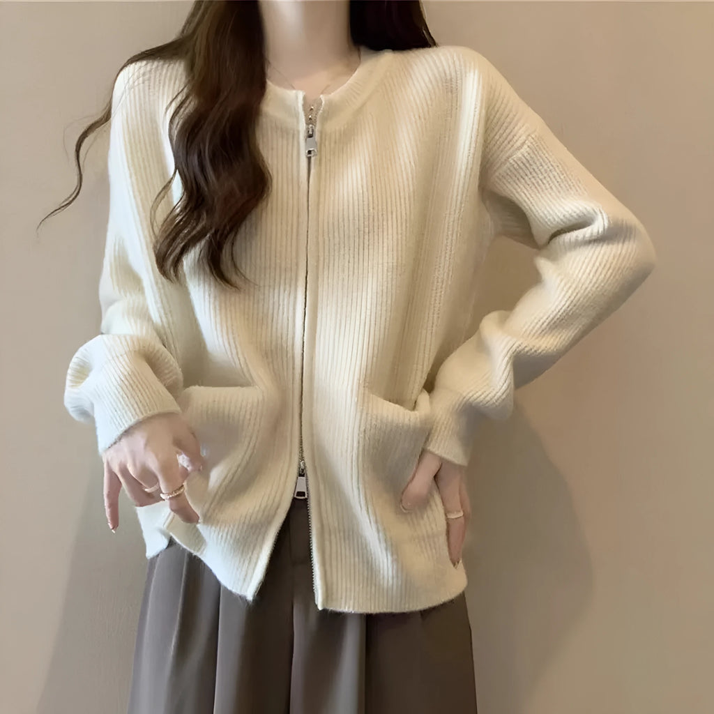 Beige viscose women's sweater coat cardigan with long sleeves laid flat.