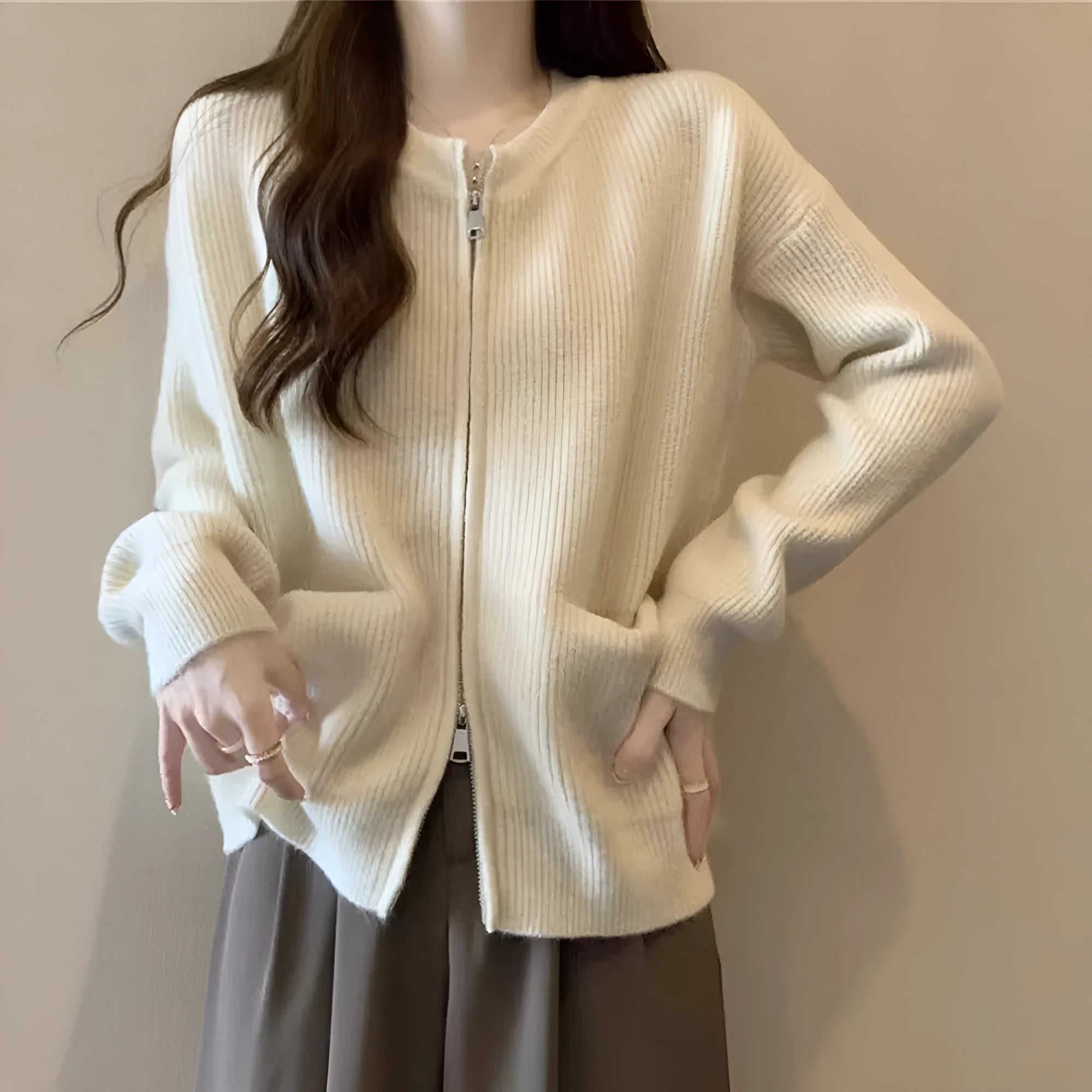 Beige viscose women's sweater coat cardigan with long sleeves laid flat.