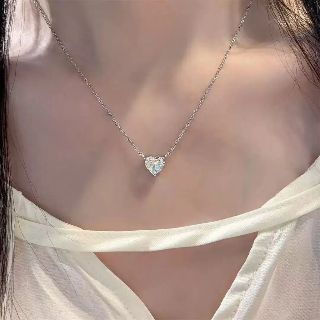 Women's silver heart necklace with copper construction and simple design