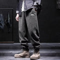 Men's grey straight leg sweatpants with an ankle-tie closure, laid flat.