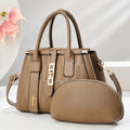 A pair of round black and light khaki PU leather crossbody bags with adjustable straps.