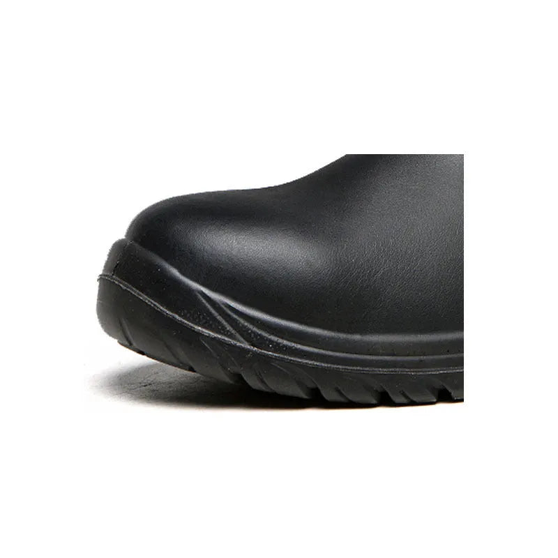 Black high-top leather safety work boots with anti-piercing sole on a work site background.