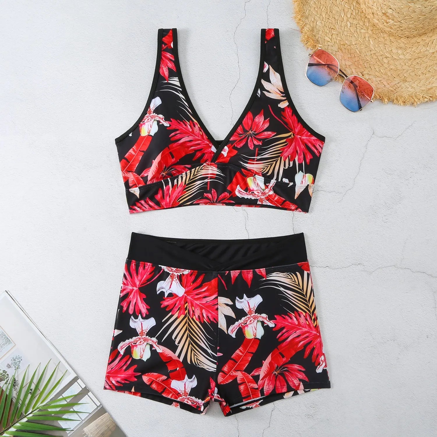 Women's two-piece swimsuit with sleeveless top and printed boxer shorts in multiple colours.