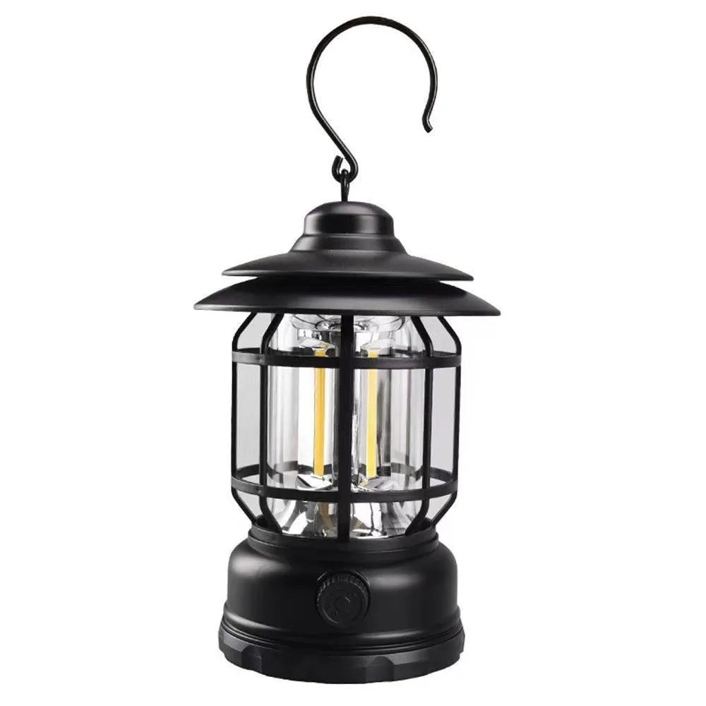 Dark green portable camping lantern with super bright LEDs, shown with a dry battery for scale.