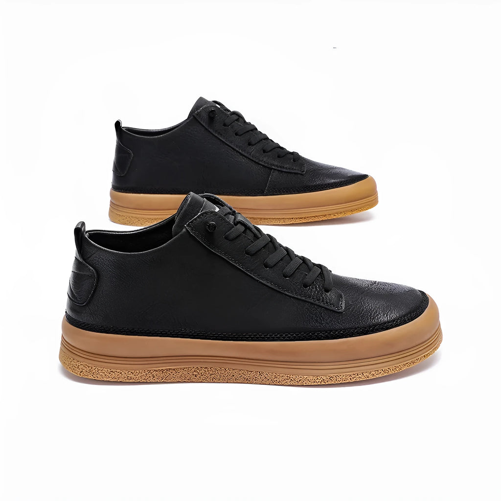 Men's black casual leather shoes with round toe and lanyard closure on soft rubber soles