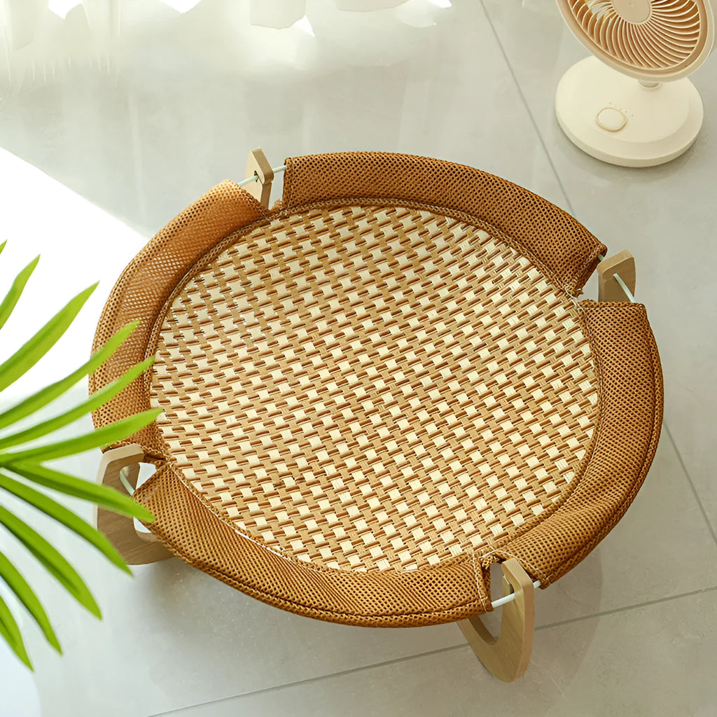 Brown woven rattan pet hammock bed measuring 46cm square raised off the ground