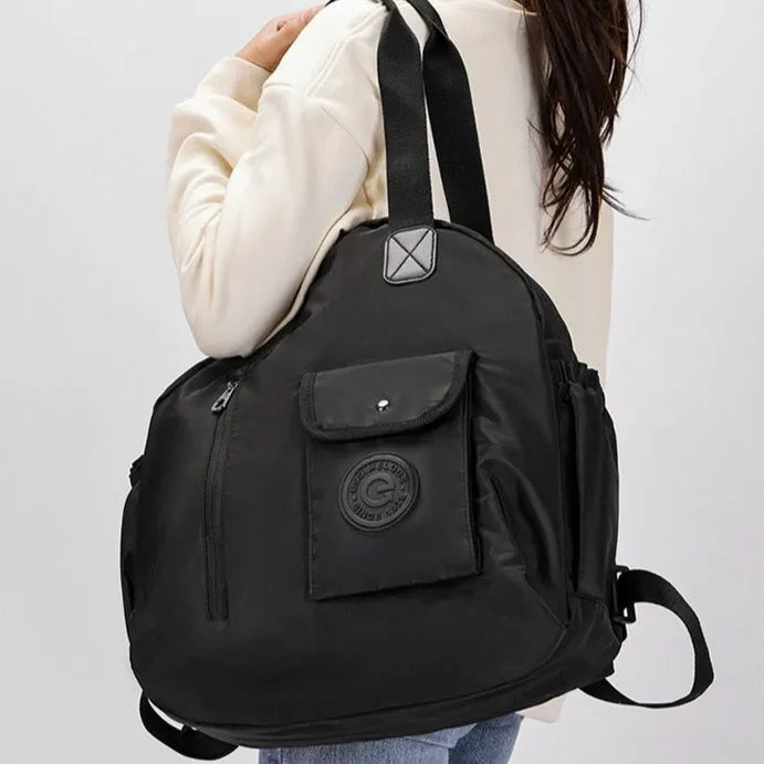 Women's lightweight nylon backpack in black, khaki, or green letter rabbit colours showing sandwich pocket design