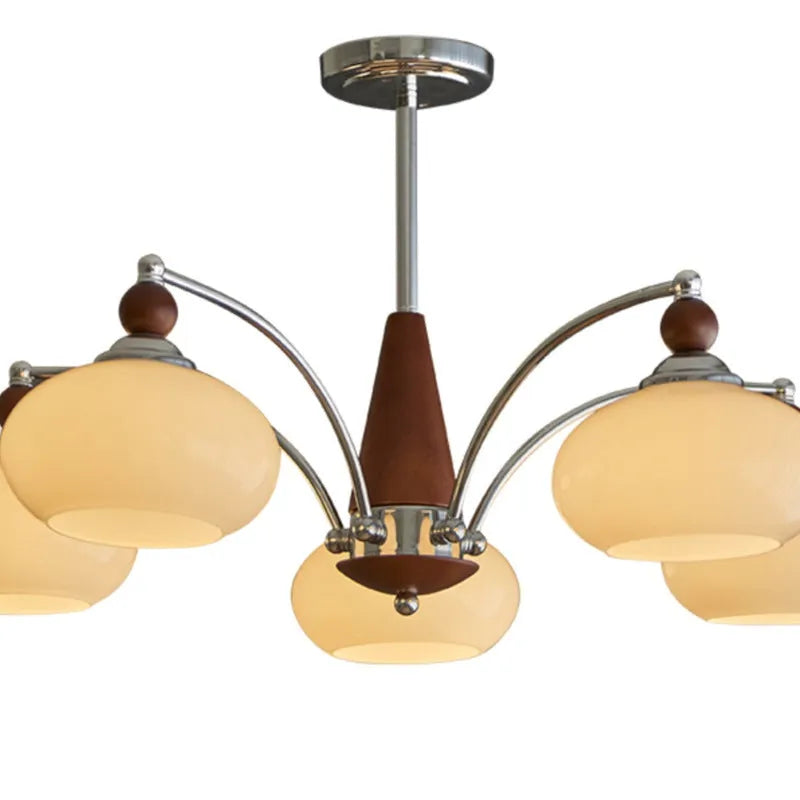 Traditional persimmon glass and chrome chandelier with multiple light heads for a dining room.