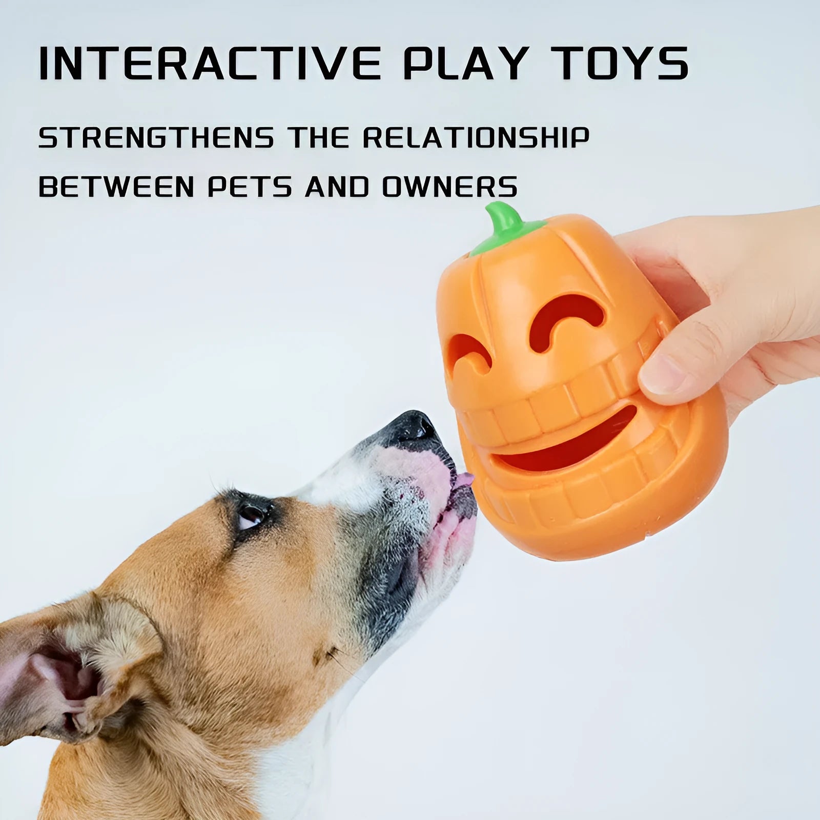 Orange Halloween pumpkin shaped rubber dog toy with a treat-dispensing funnel.