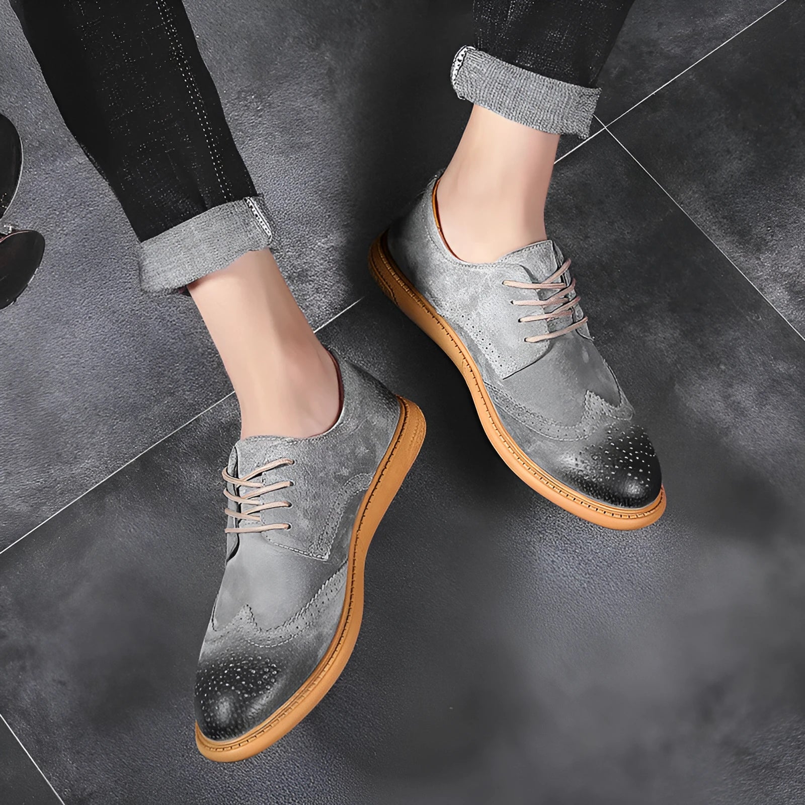 Men's black genuine cowhide business lace-up shoes with leather toe cap on a grey background.