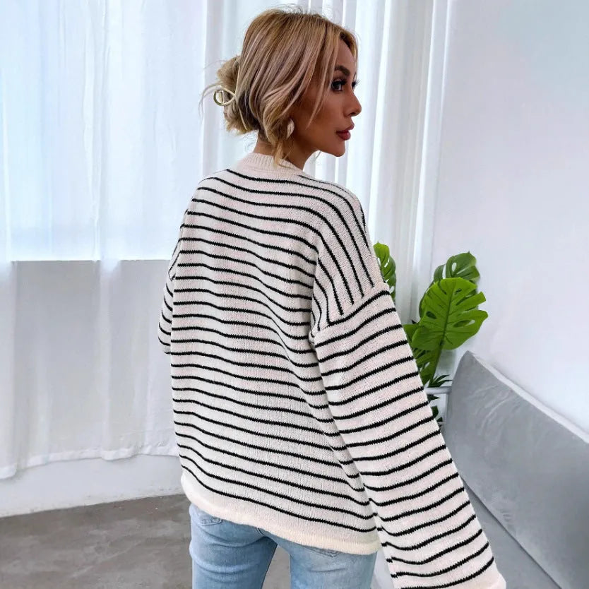 Black striped women's knitted top with drop shoulder sleeves and button detailing