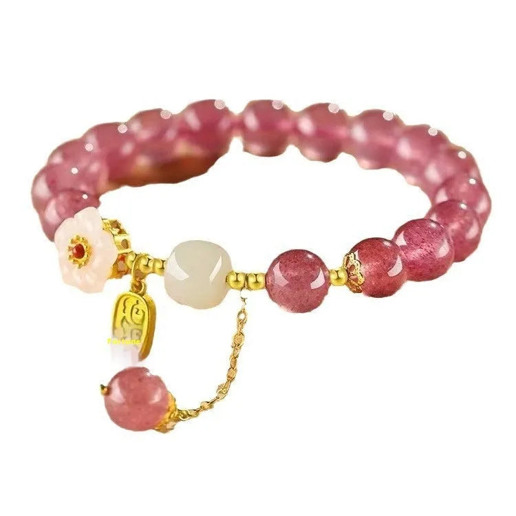 Handmade natural crystal bracelet with strawberry quartz decorative elements in pearl, moon, XINGX, or green design options