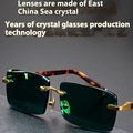 Dark green crystal frameless sunglasses with protective case and lens cleaning cloth