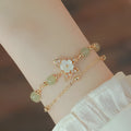 Yellow gold electroplated copper bracelet with shell flower butterfly and Hetian jade design for women