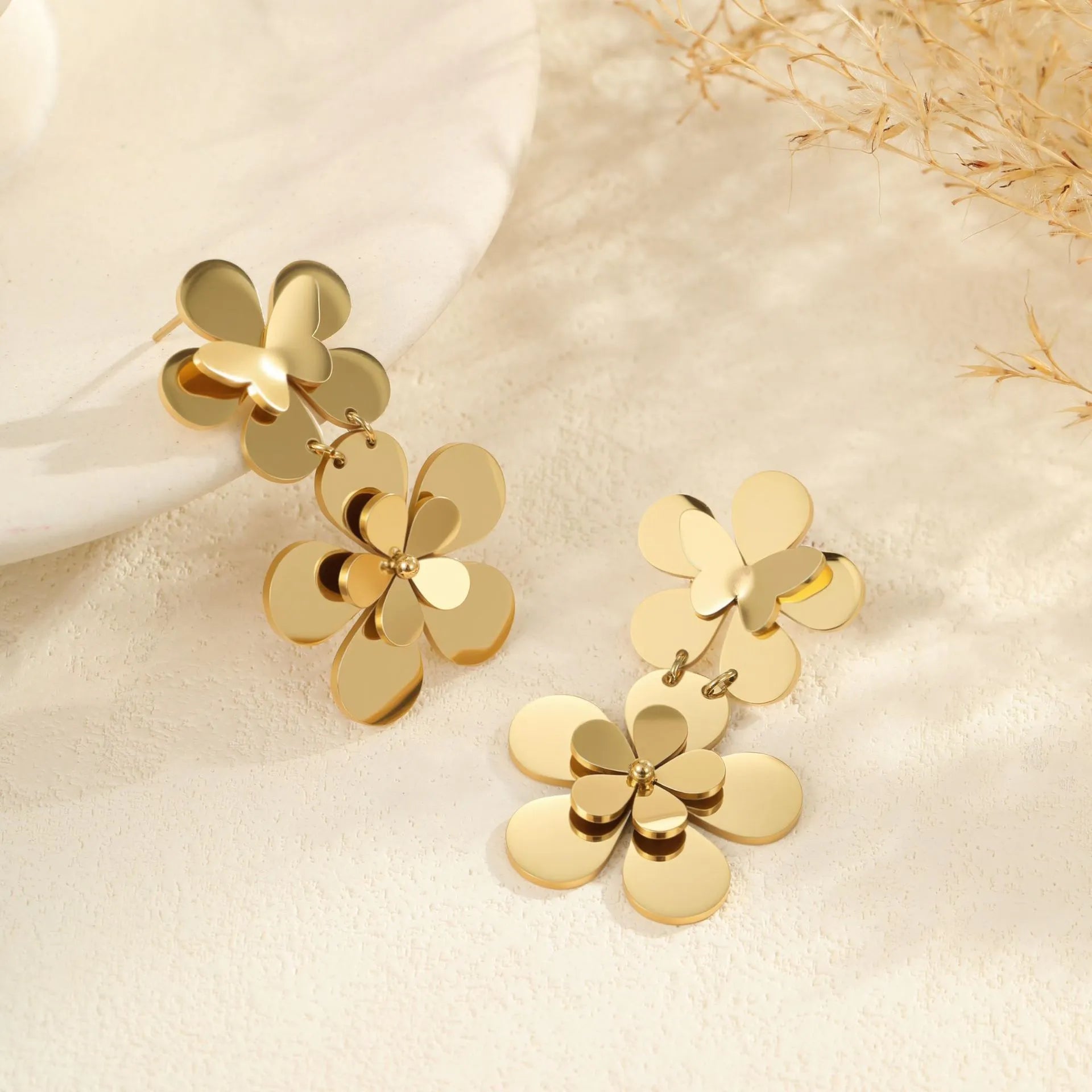 Gold-coloured stainless steel earrings with flower and butterfly design for women