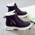 Women's plus size tall black snow boot with velvet lining and lace-up front on a rubber sole.
