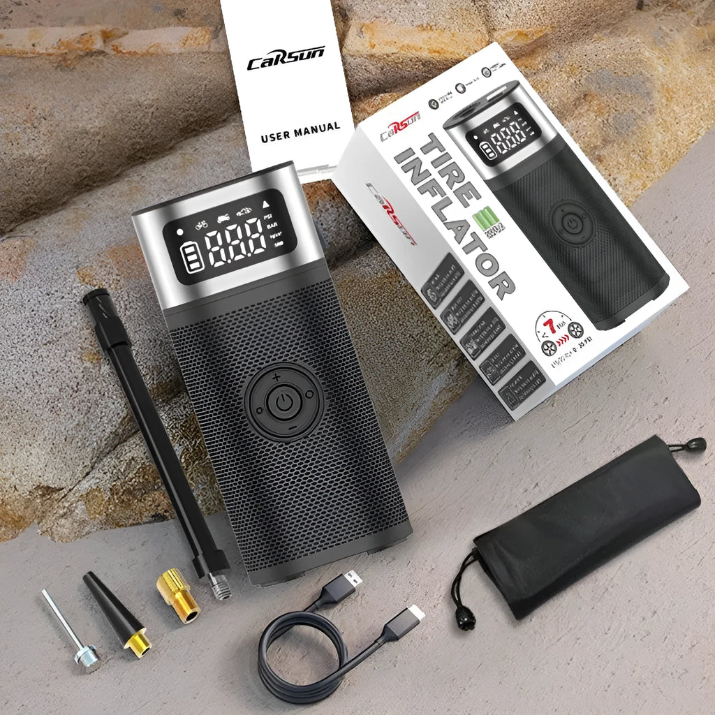Black portable wireless vehicle air pump with inflatable tube and nozzles on a storage bag