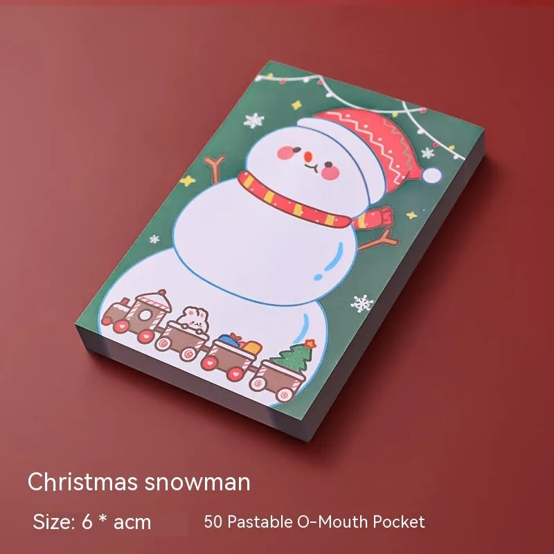 Christmas sticky notes book showing cartoon designs of Elf, Gift, Sled, Ball, Santa, House, Bear, and Snowman