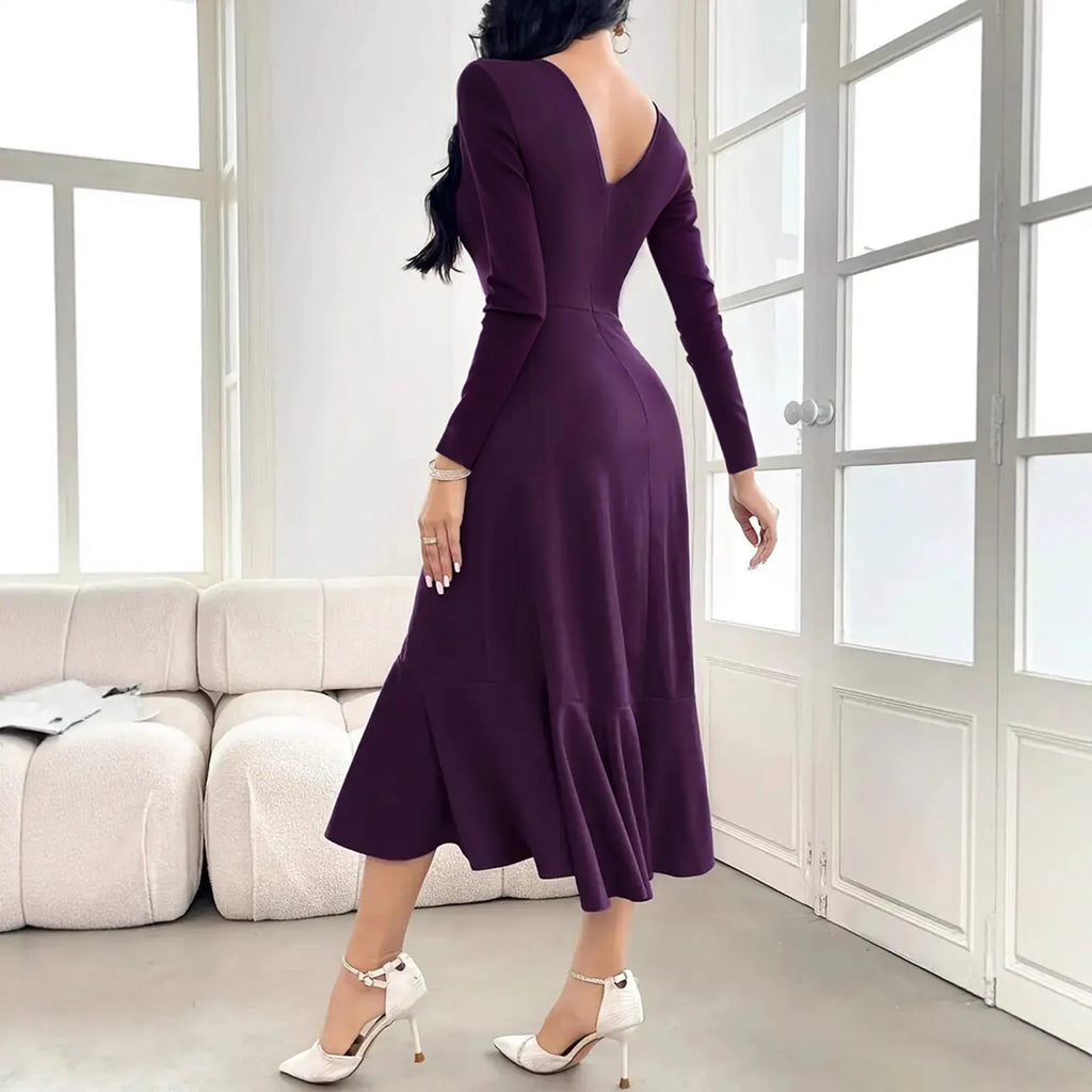 Purple women's dress with long sleeves, round neck, and ruffle detailing.