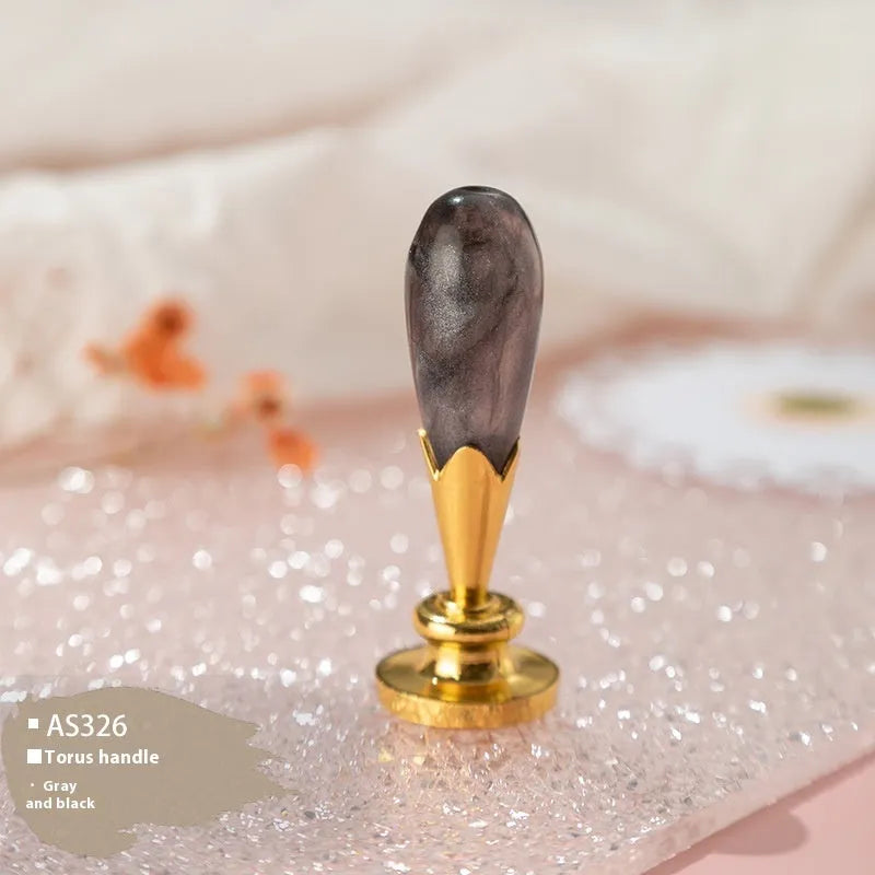 Wooden wax seal handle in a selection of different colour and decorative finishes.
