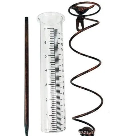 Traditional cast iron bird-shaped hyetometer with glass measurement cylinder showing 800ml capacity
