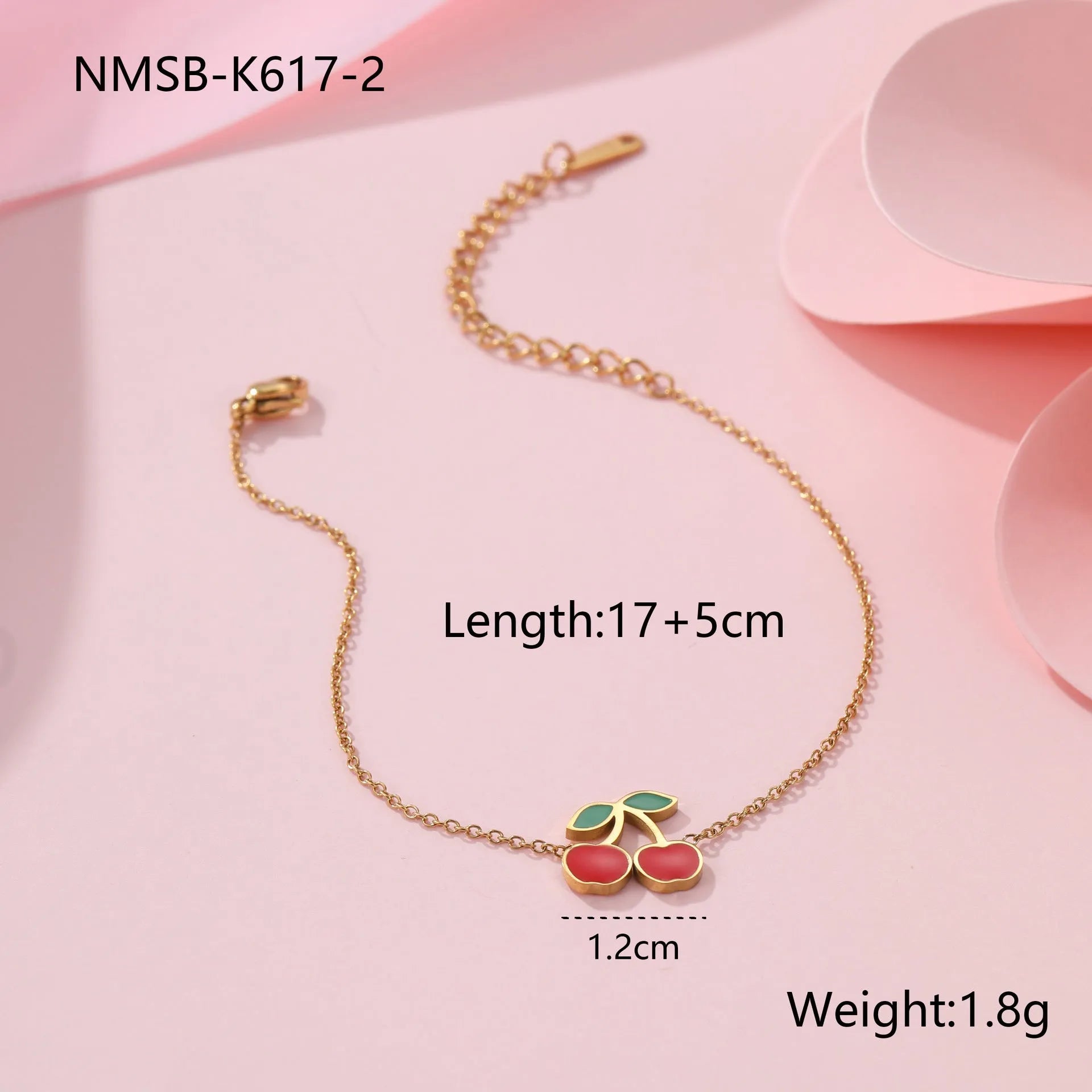 Cherry jewellery set with stainless steel necklace, bracelet, earrings, and ring featuring geometric shapes and 18K plating