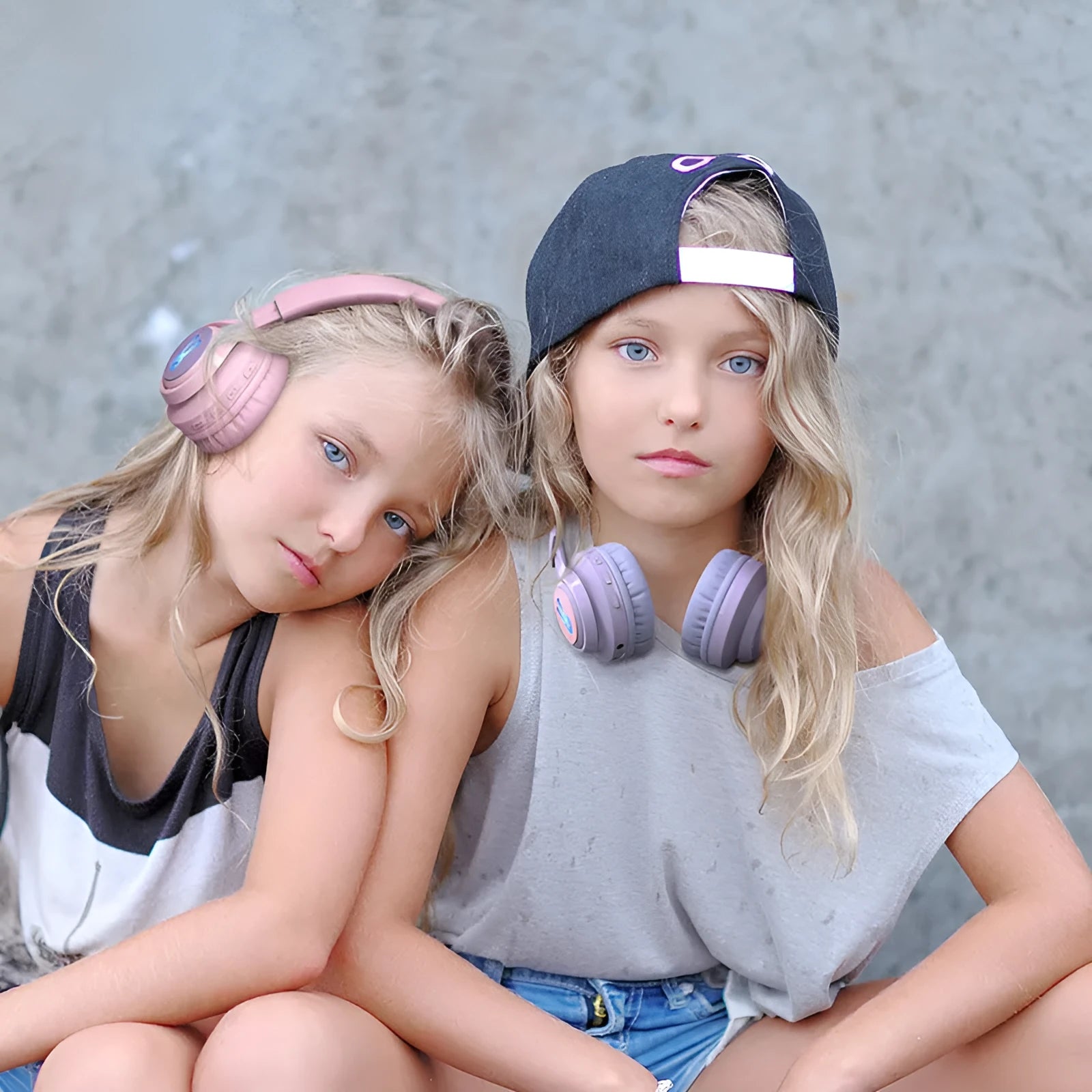 Wireless children's headphones in bunny pink and purple with RGB lights and power display