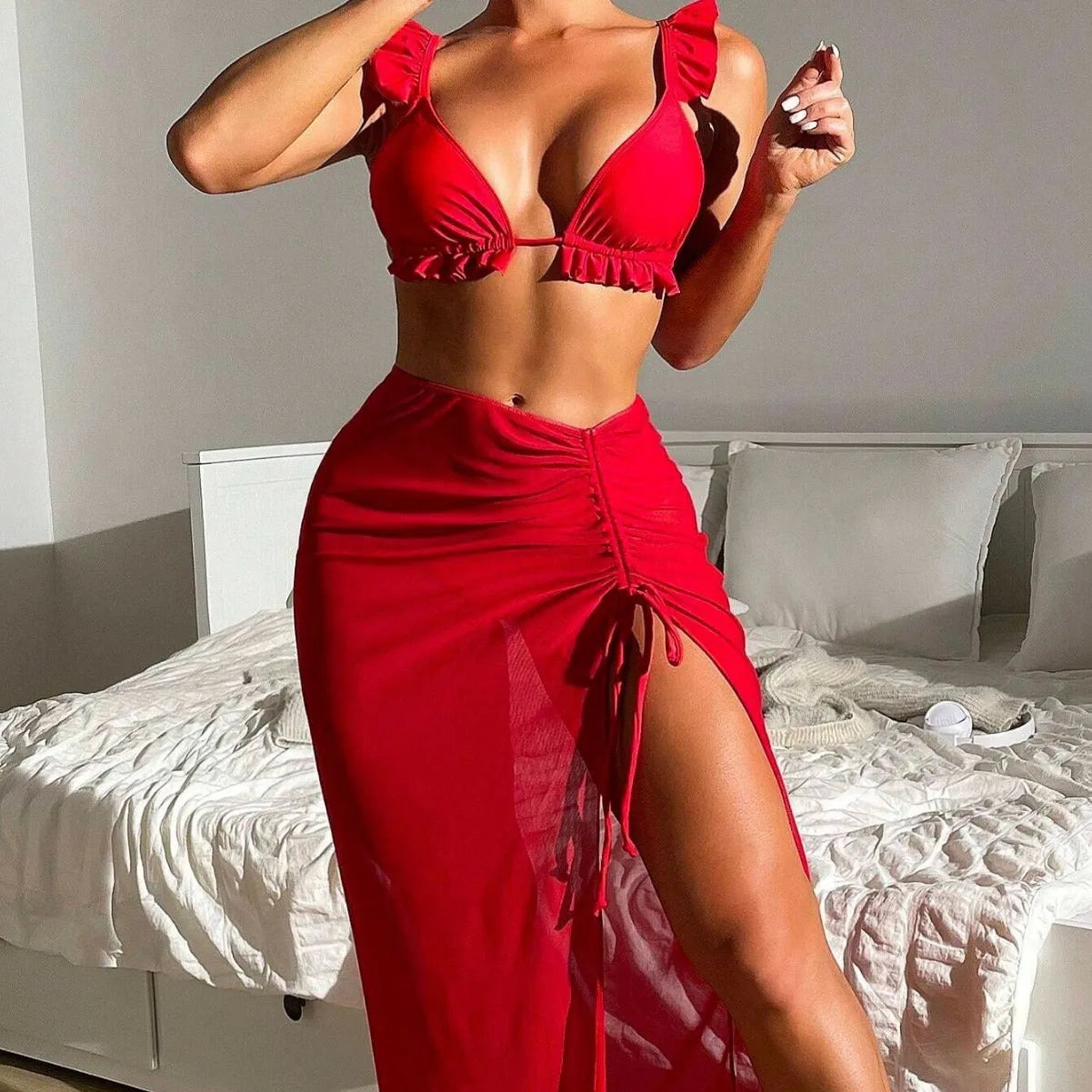 Women's three-piece split swimsuit set with skirt style top and pants in colourful polyester fabric