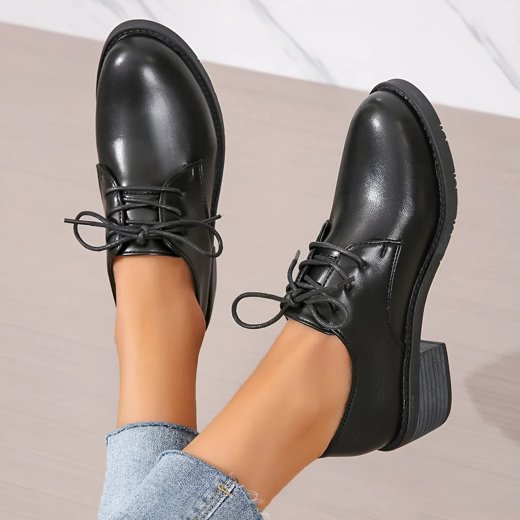 Black women's work shoes with thick chunky heel, PU leather upper, and rubber sole
