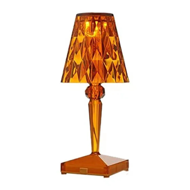 Rose gold plated acrylic portable touch night light with projection feature and rechargeable base on a wooden table