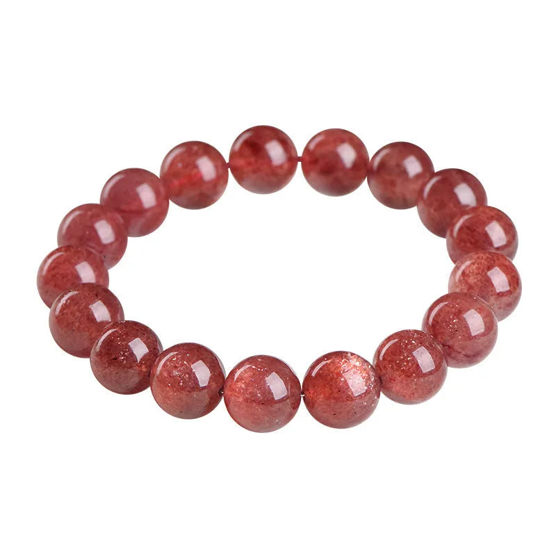 A bracelet made of geometrically cut, pink strawberry quartz beads in three size options.