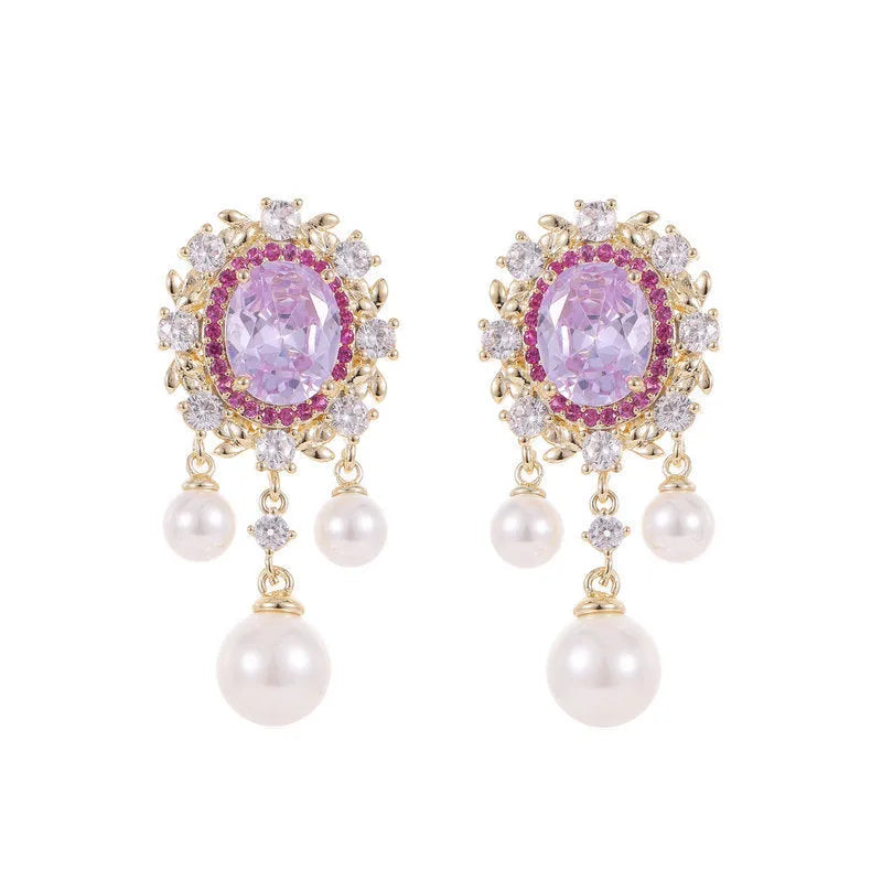 Oval-shaped copper earrings with zircon-inlaid pearls and long decorative tassels in light purple.