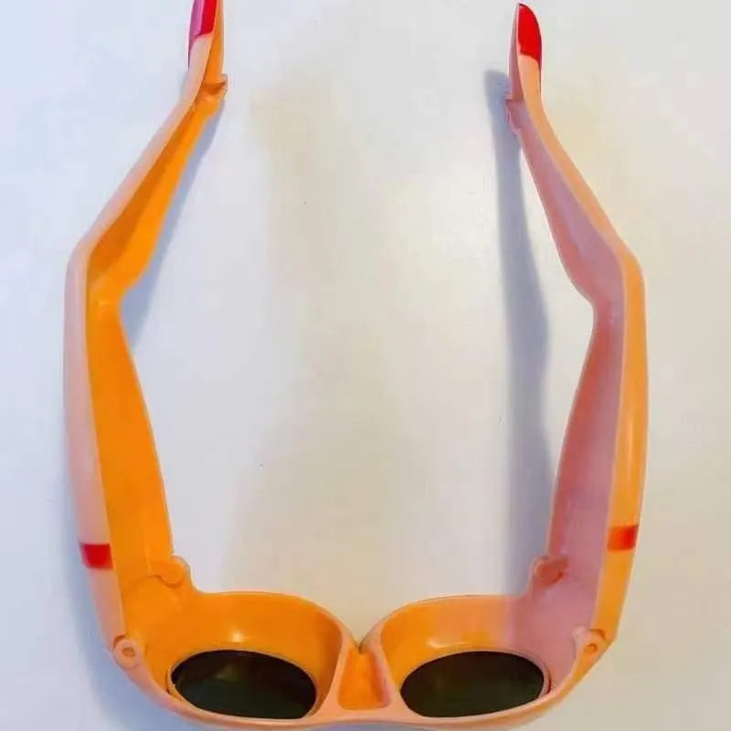 Orange plastic Personality Leg Hip Sunglasses showing novelty leg and hip motif design.