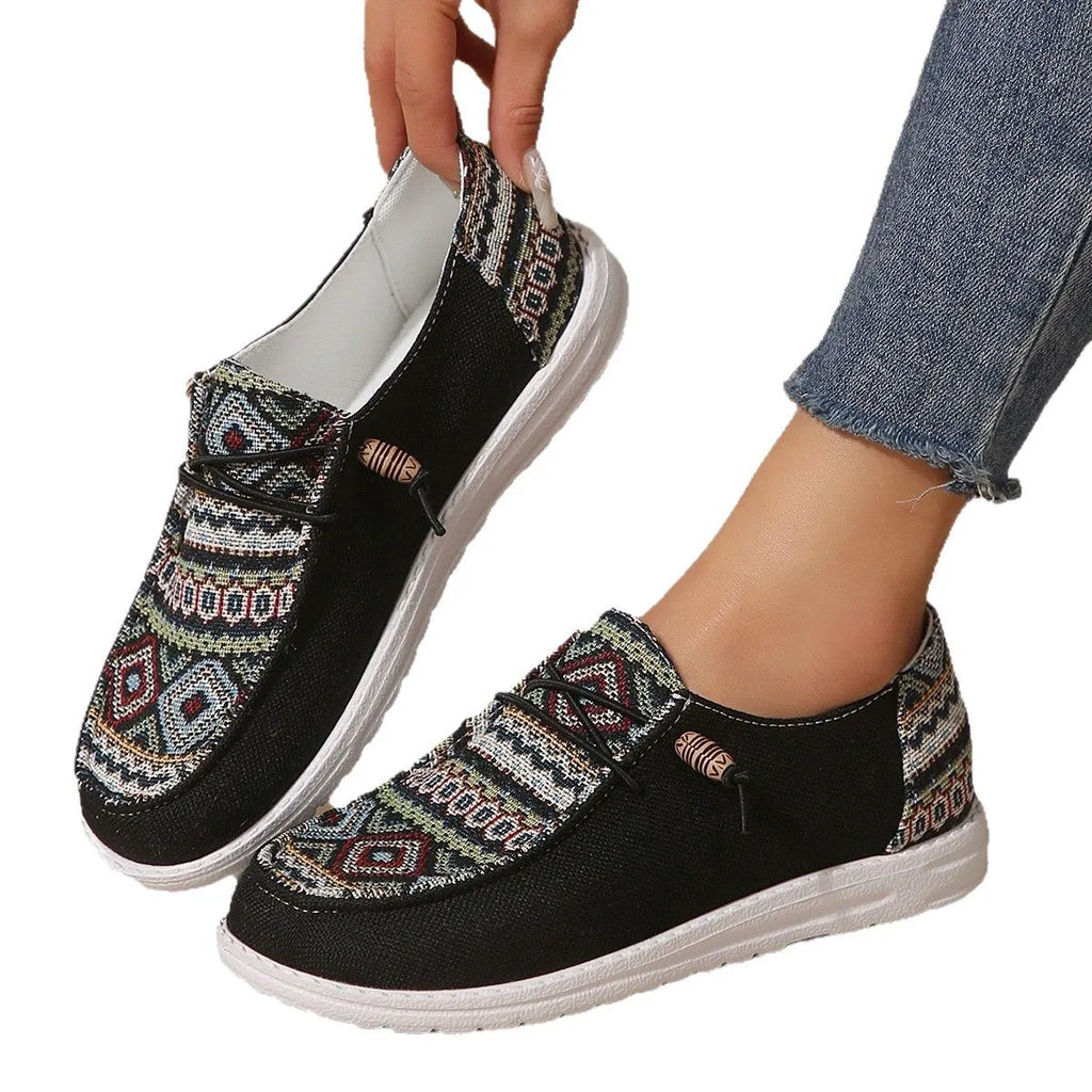 Women's black slip-on flat shoes with round toe and artificial PU upper