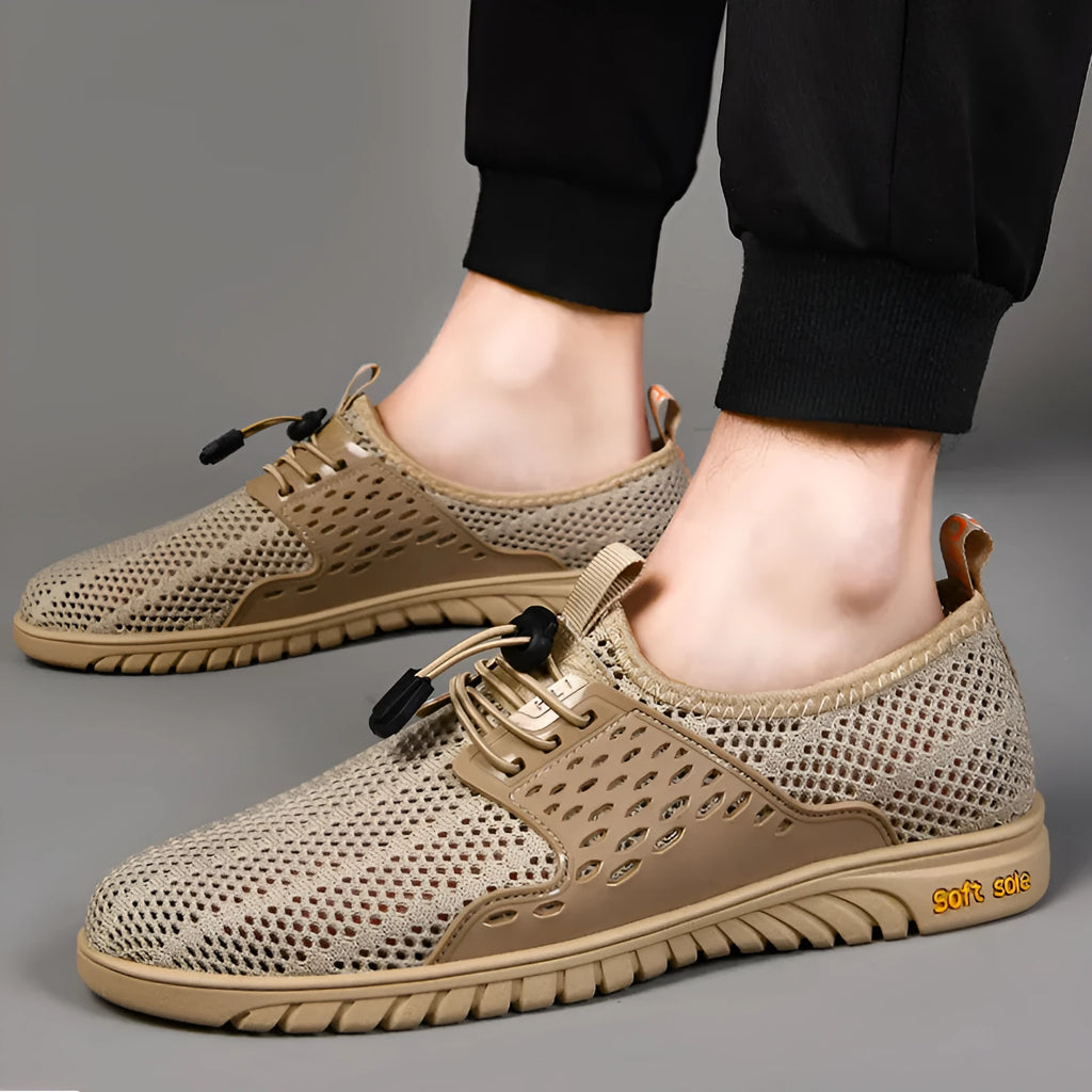 Men's black breathable mesh casual shoes with elastic band and rubber sole.