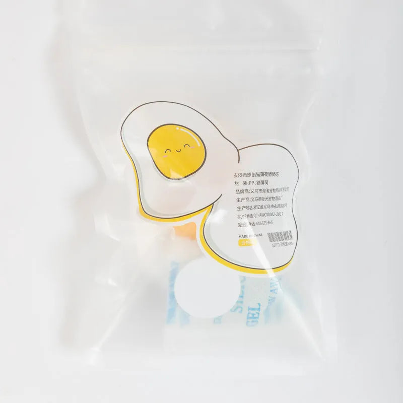 Soft plush catnip ball toy attached to wall for interactive feline play