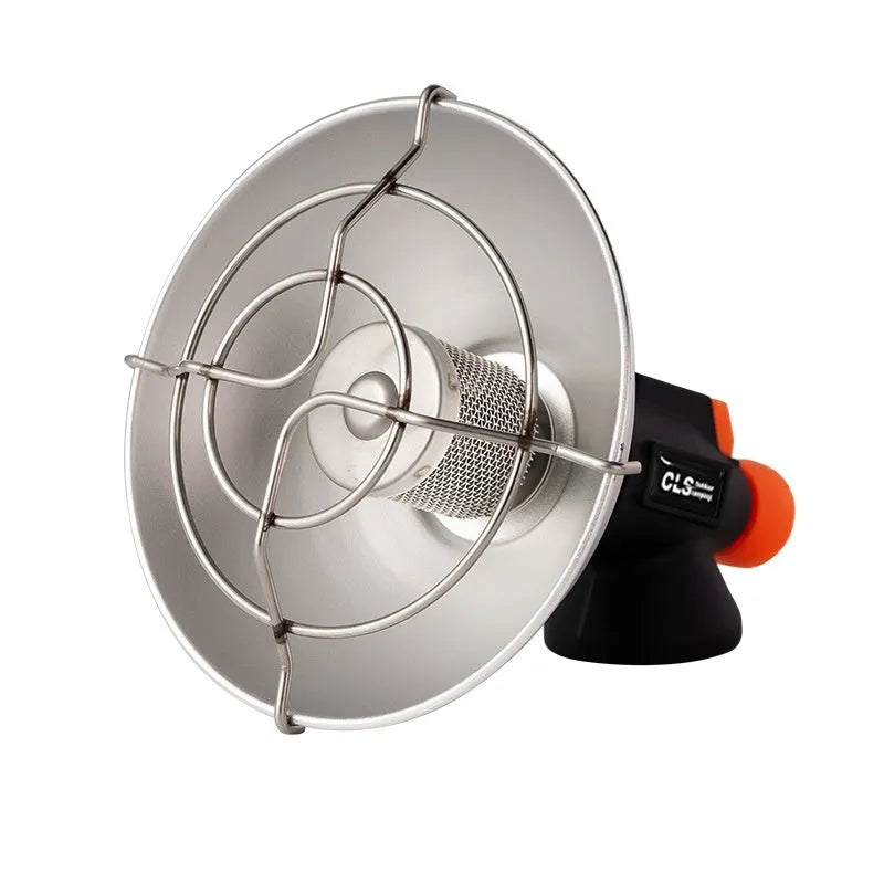 Black and orange portable camping heater stove with automatic ignition on a table.