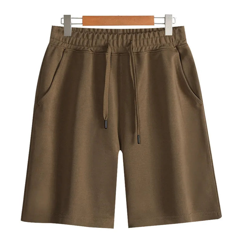 Straight leg cotton sports shorts in light grey on a neutral background.