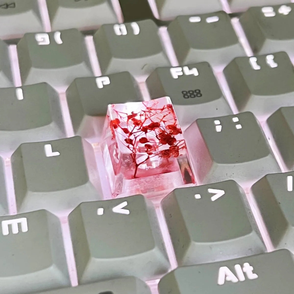 Resin starry sky artisan keycap in green, pink, red, or violet for mechanical keyboard customisation.